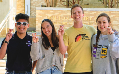 Several students standing in front of Milton Daniel Hall